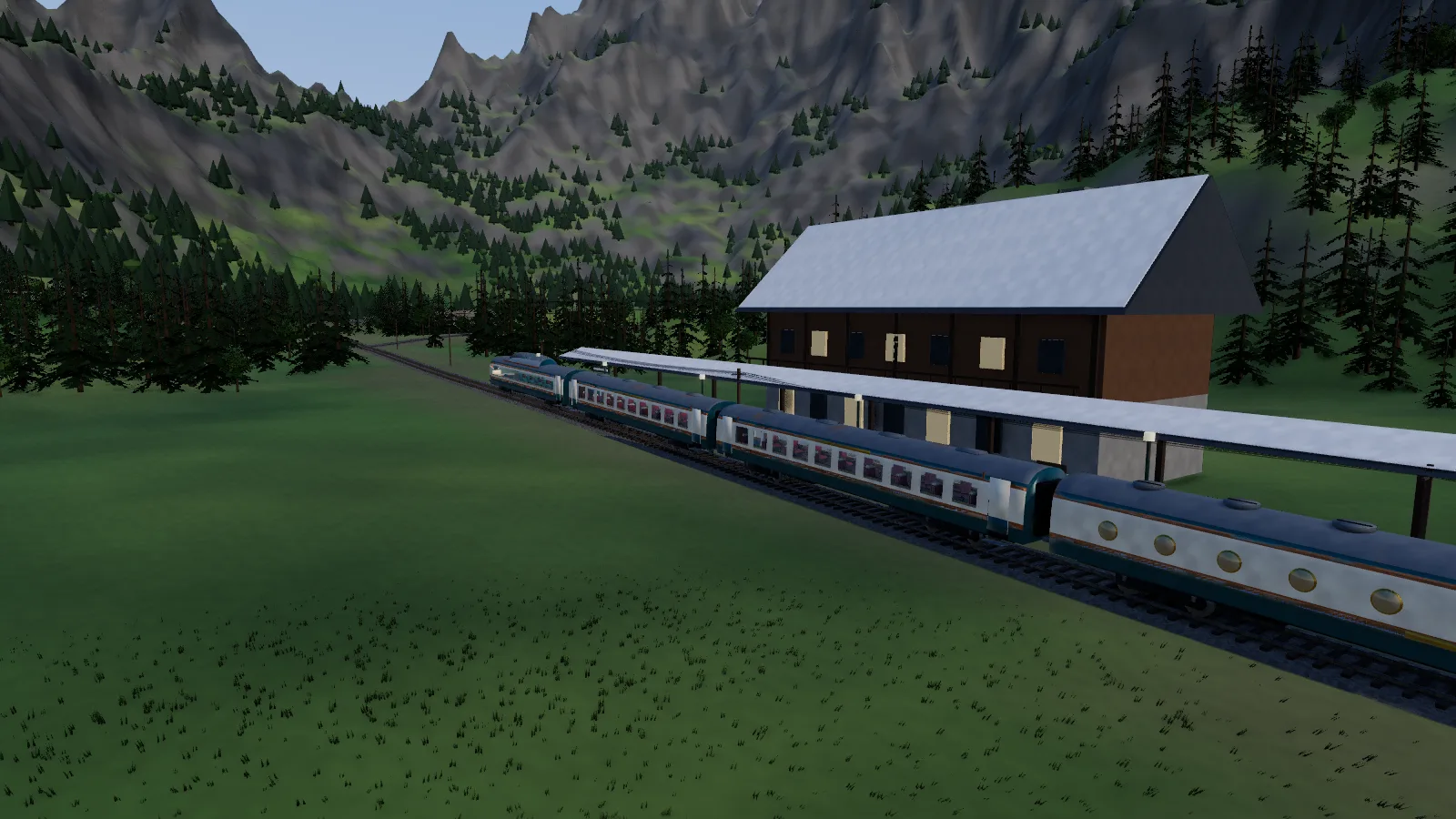 The train at Granite Pass, nose first, beside the chalet station.