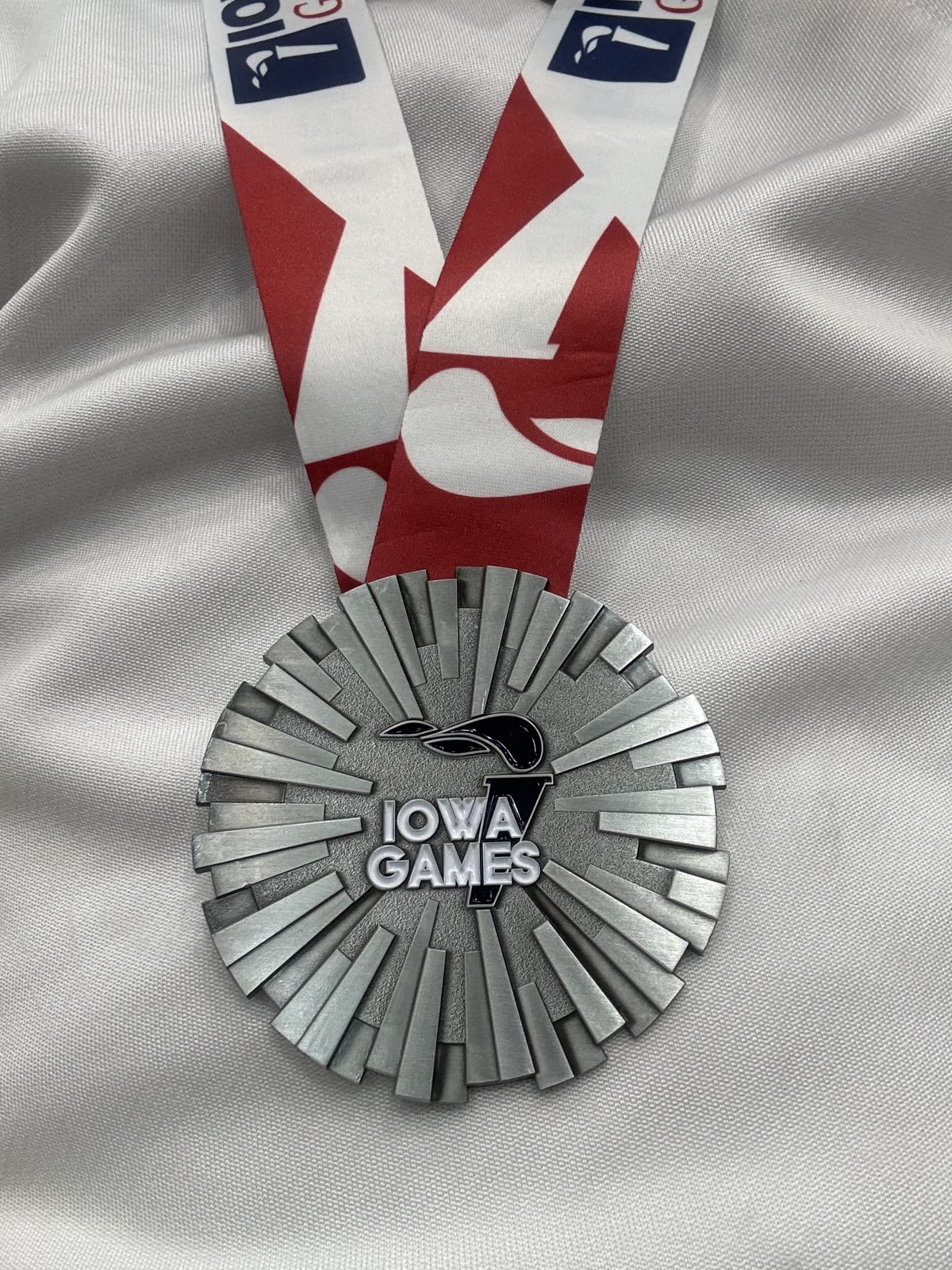 Eric Rhea with the Iowa Games fencing silver medal, 2025