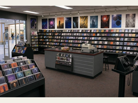 The record store, with CD racks and a checkout counter.