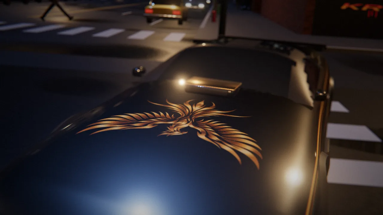 Close-up of the black car's hood at night with a gold phoenix emblem catching the street light.
